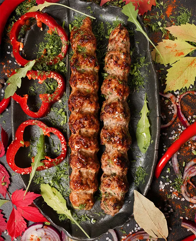 Köfte and peppers over charcoal