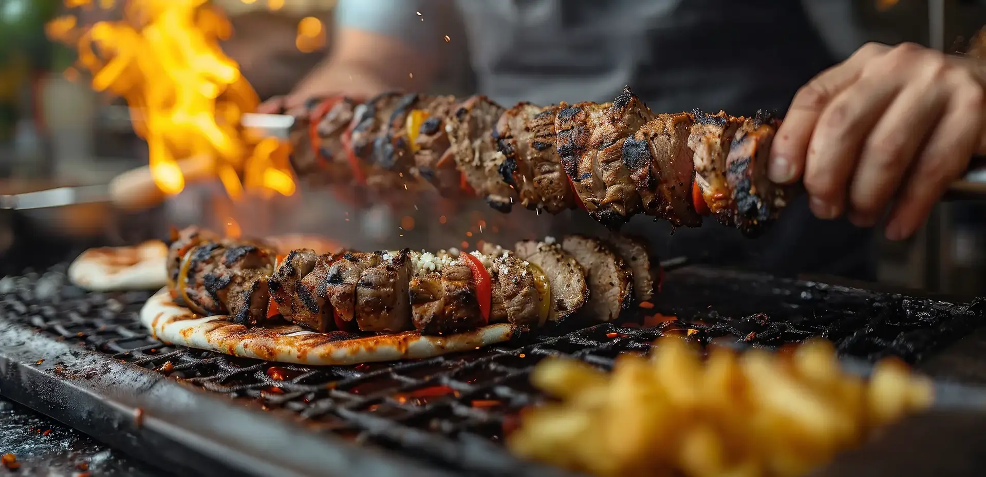 Turkish meat skewers cooking over charcoal