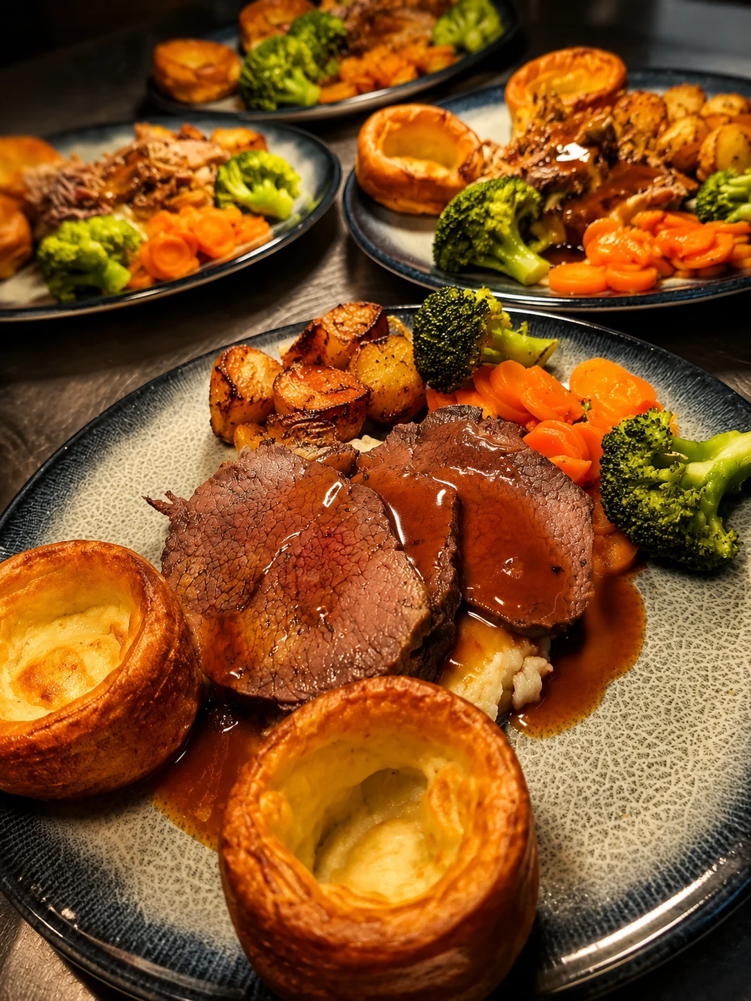 Beef Sunday roast with Yorkshire puddings and vegetables